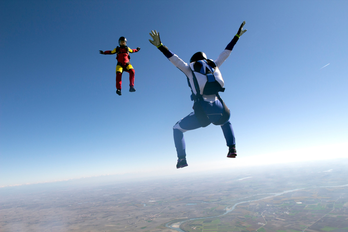 Freeflying skydivers in blue sky